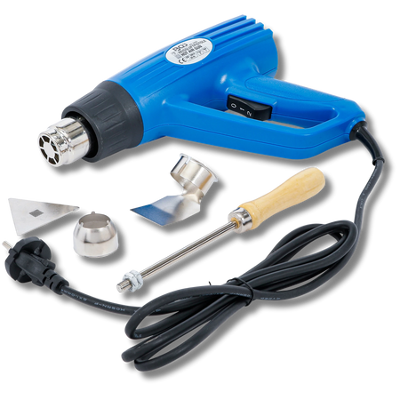 Bild eines Heißluftföns mit zugehörigem Werkzeug, fotografiert von schräg vorne